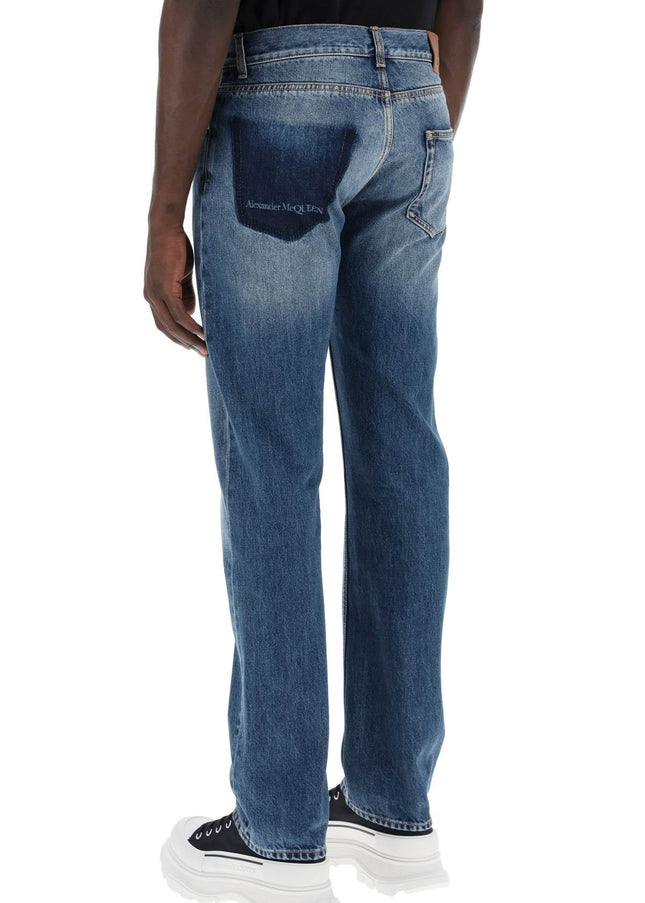 Alexander Mcqueen straight leg jeans with faux pocket on the back.