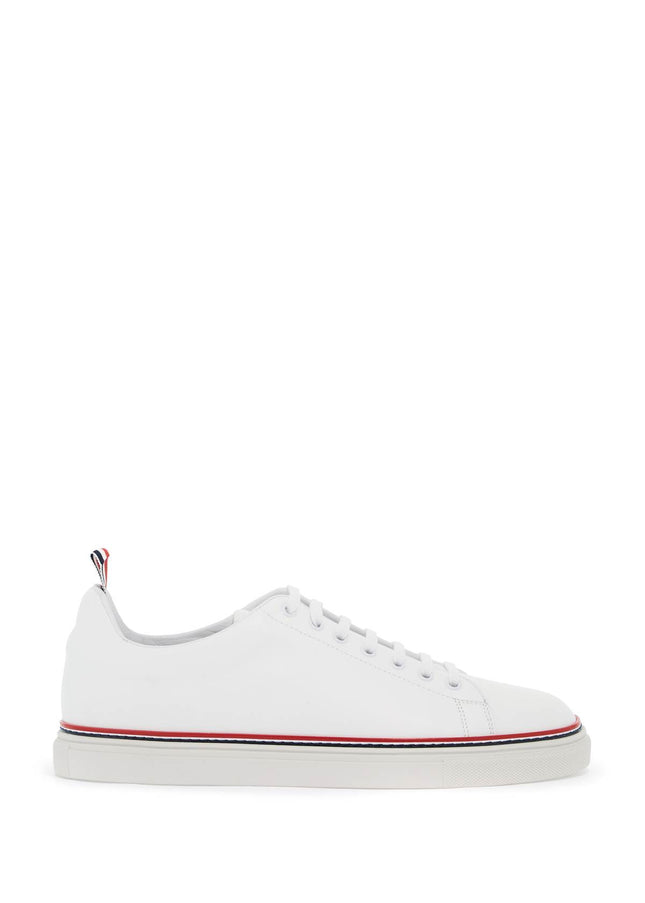 Thom Browne smooth leather sneakers with tricolor detail.