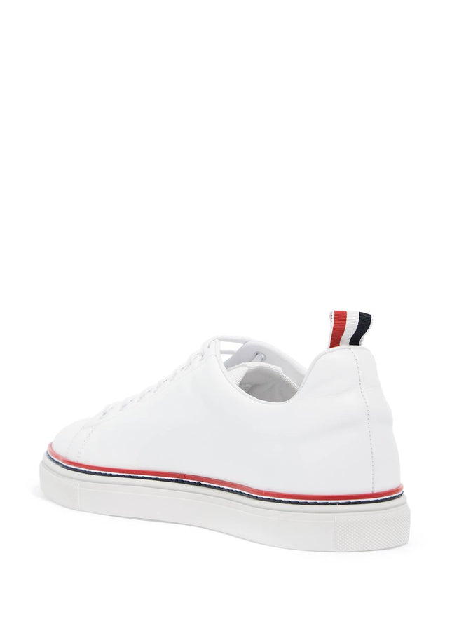 Thom Browne smooth leather sneakers with tricolor detail.