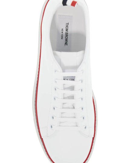 Thom Browne smooth leather sneakers with tricolor detail.