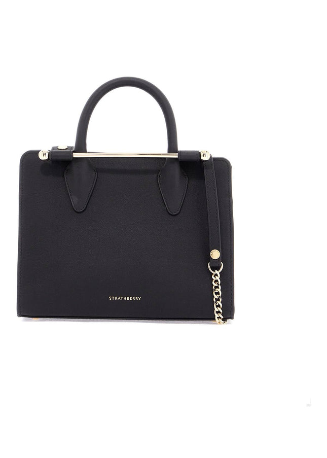 Strathberry mini tote structured in black leather with gold details