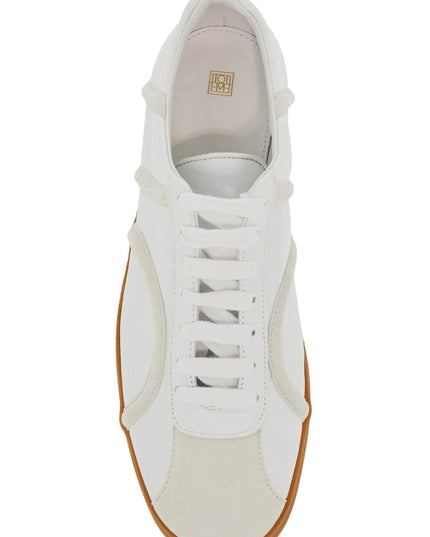 Toteme leather sneakers with suede monogram