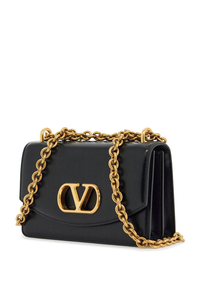 Valentino Garavani borsa a spalla small in pelle nera con catena dorata