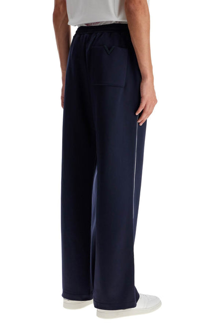 Valentino Garavani jogger pants with metallic v detail