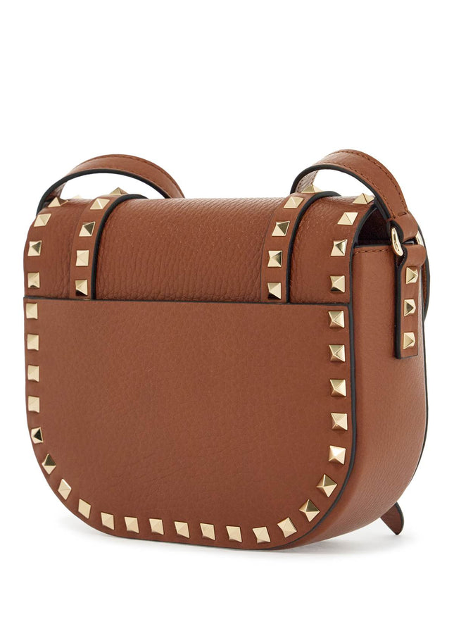 Valentino Garavani small messenger crossbody bag in brown hammered leather with studs