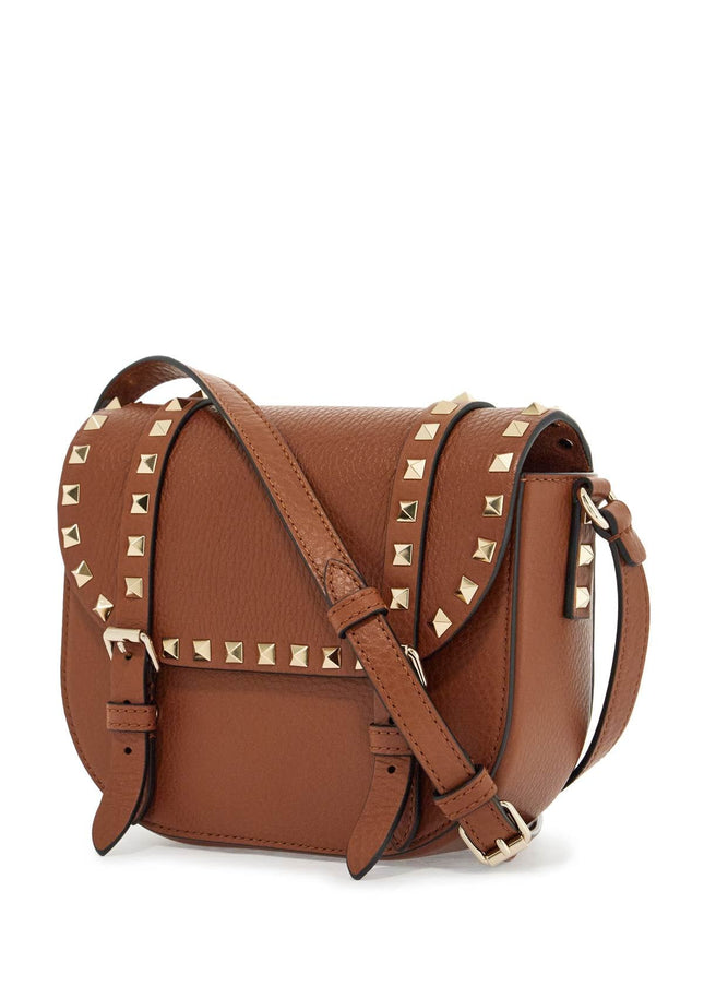 Valentino Garavani small messenger crossbody bag in brown hammered leather with studs