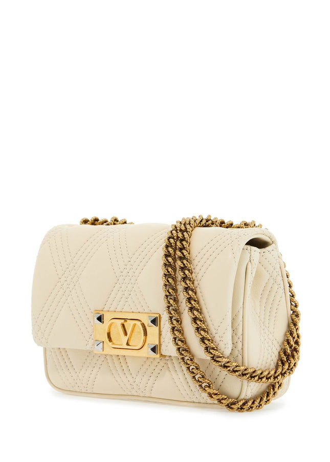 Valentino Garavani small shoulder bag in leather with golden chain butter white