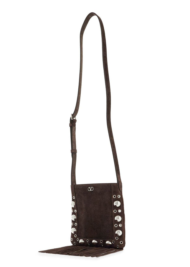 Valentino Garavani small suede crossbody bag in dark brown with studs and fringe